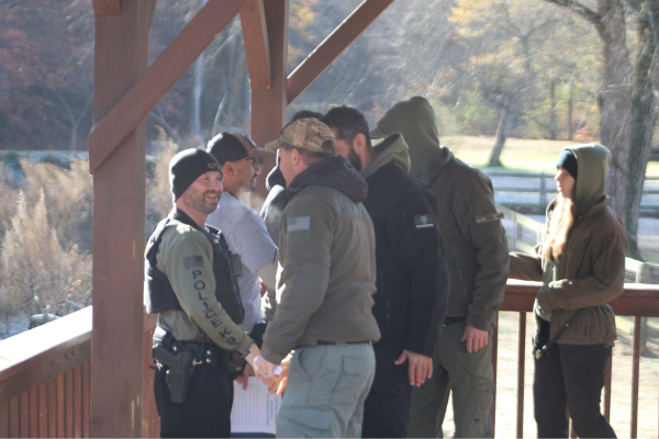 Group of Trainer and Handler students at their graduations being congratulated by CCU Trainers