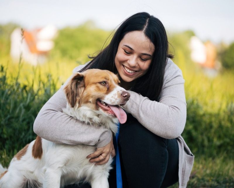 Happy Dog Owner Bonding With Dog Happy Dog Owner Bonding With Dog